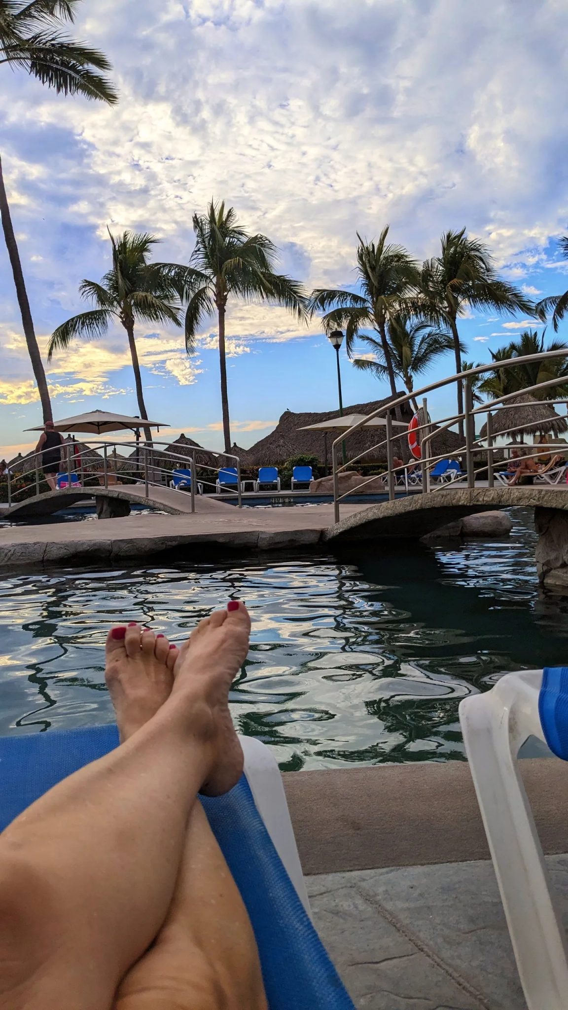 Relaxing by the pool at Paradise Village