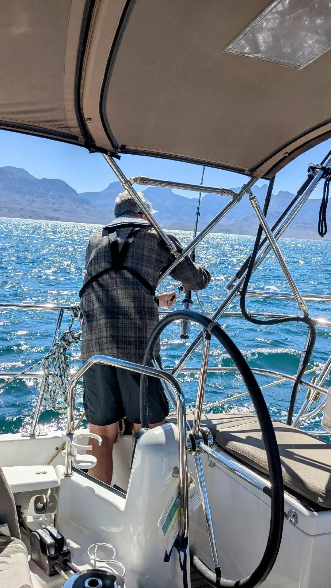 Kevin rigging his fishing line while underway