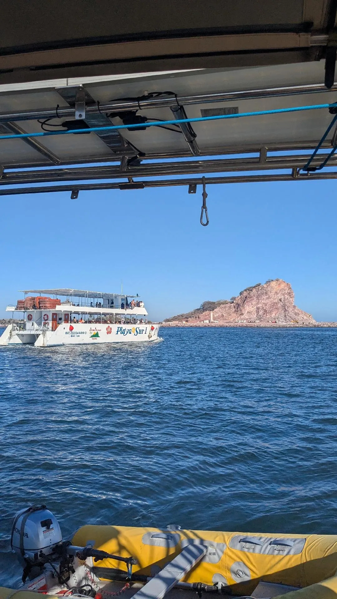 Party boat heading out into the bay for an evening of fun while blasting mariachi music, Mazatlan