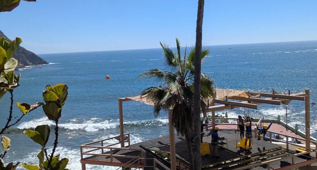 Zipline from the lighthouse on top of the hill to the platform on the right of the photo