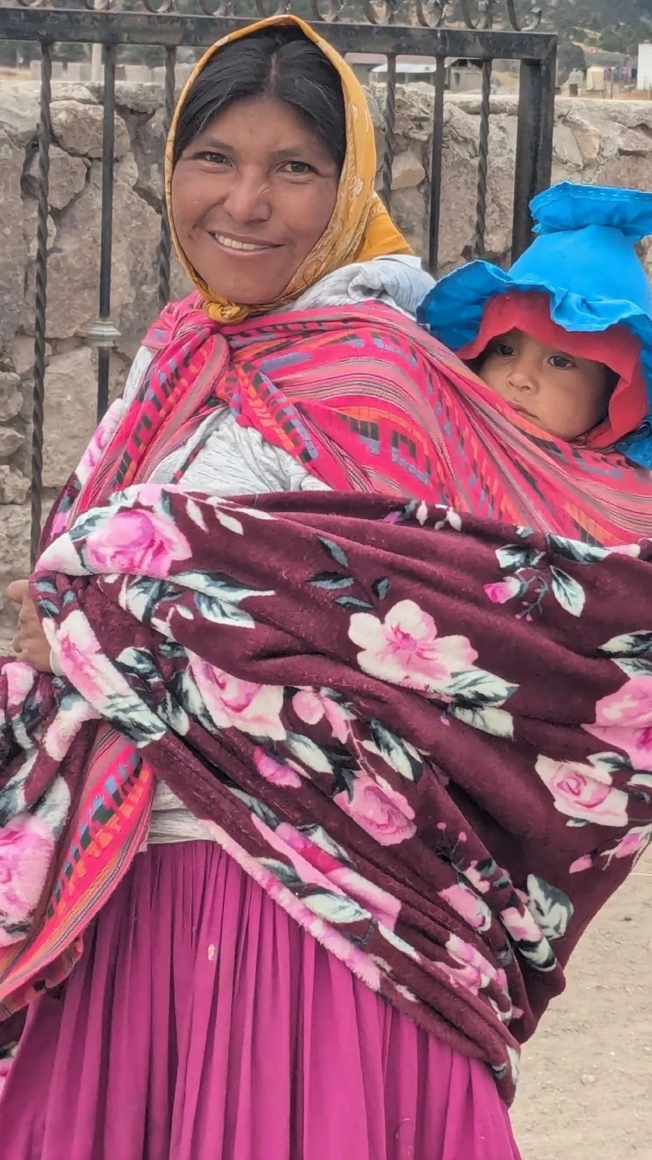 Indigenous woman walking with her baby in Copper Canyon